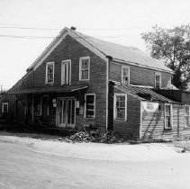 "Little Red Mill," first home of the Romeo Observer, to be razed